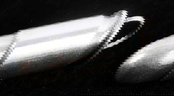 .999 SILVER BULLET PENDANT BY BUFFALO DANCER: Small silver bullet pendant from Buffalo Dancer LLC. Stamped 'AG' and '.999.' 1.5 inches. 31.5 grams. This lot has a reserve.