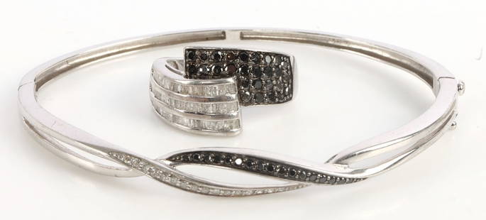 STRELING SILVER BLACK AND WHITE DIAMOND BRACELET: Hinged bangle with melee point diamonds. Fits a 5 - 6 inch wrist. Weight: 7 grams. Comes with matching ring. size 7.5.