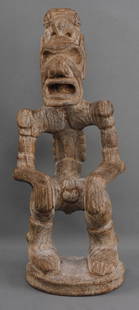 PRECOLUMBIAN TAINO SITTING MALE EFFIGY WOOD: Taino (1000-1500 CE) effigy of a male figure in a sitting position. The figure is elongated and emaciated, interpreted by some to mean the figure is shamanic or under the prolonged influence of