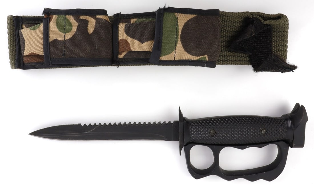 VIETNAM IMPERIAL KNUCKLE DUSTER FIGHTING KNIFE: Stamped imperial at ricasso. Well-crafted. Includes camo sheath. 11.5 inches overall.