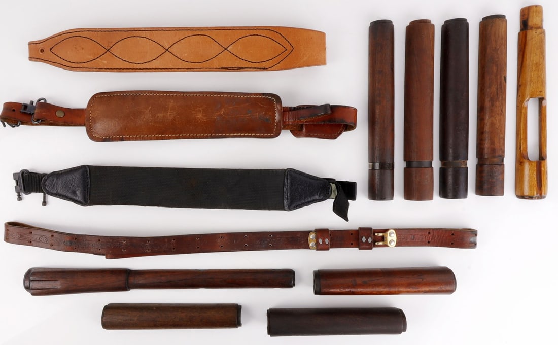 LOT 13 FIREARM HOLSTER STRAP AND TRIGGER FOREARMS: Includes 4 holster straps (3 leather and 1 nylon) and 9 wooden firearm trigger forearms, including M1 and M1903. Very good condition.