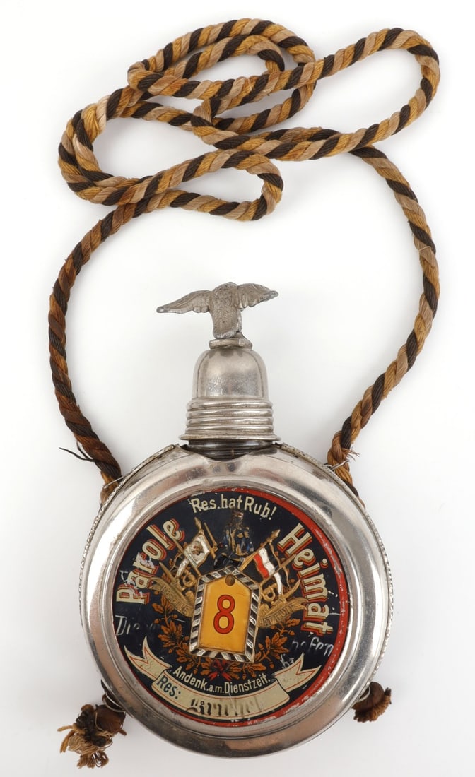 IMPERIAL GERMAN PRE-WWI RESERVIST CANTEEN: Imperial German reservist canteen. Corded, with an eagle cap. Eagle is broken at ankles, but attached. Does not fasten close. 5 inch diameter.