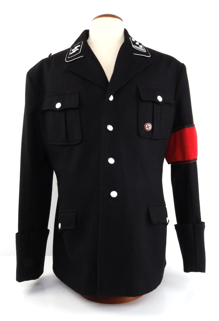 WWII GERMAN SS OFFICER TUNIC W/ INSIGNIA & ARMBAND: High quality postwar piece, size L/XL. SS officer's black wool tunic with armband, Untersturmfuhrer collar tabs and NSDAP enamel pin (reverse marked "RZM M1/25"). Good condition. Left shoulder missing