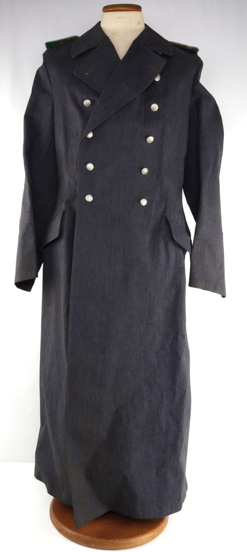 WWII GERMAN THIRD REICH WEHRMACH GHABARDINE COAT: Ghabardine jacket for the Wehrmacht, with green piping on shoulder tabs. Shoulder tab bullion lightly fluoresces. Green cloth has mothing. 54 degrees collar to hem, 19 inches shoulder to shoulder, 27-