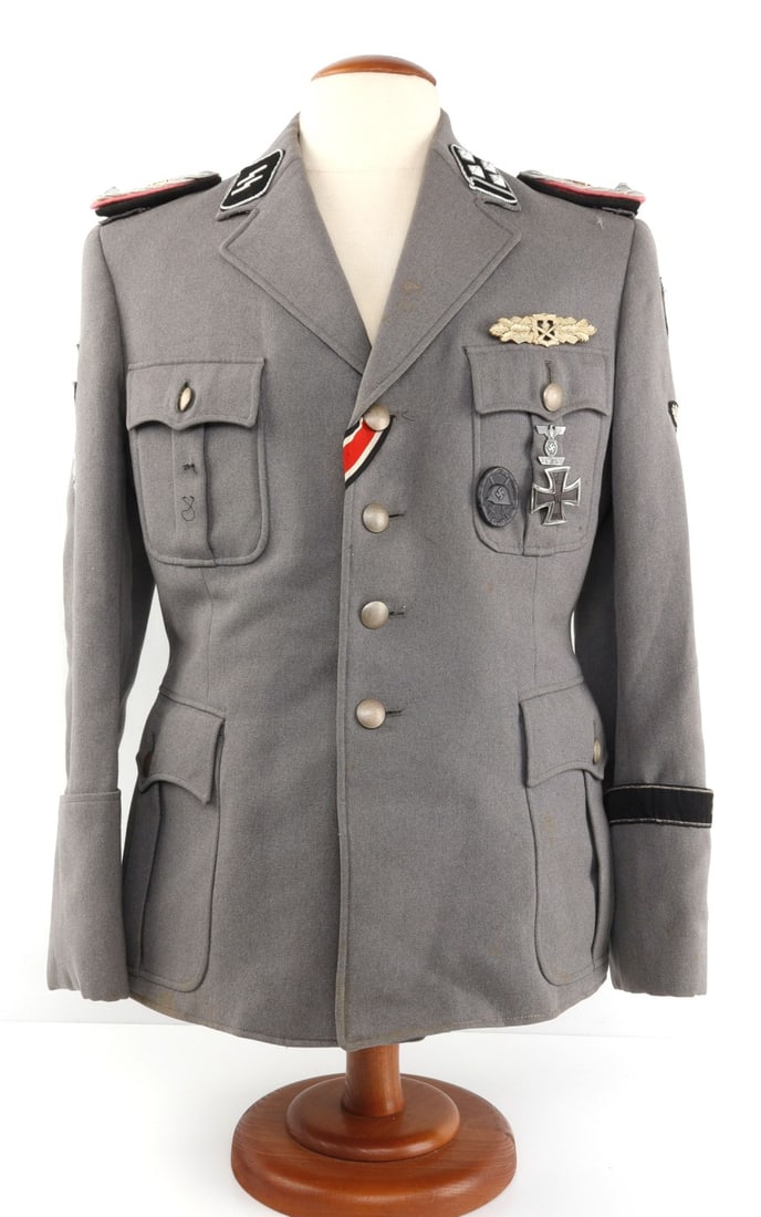 WWII GERMAN SS OBERSTURMBANNFUHRER TUNIC: Grey tunic with post war medals and badges such as Iron Cross, Close Combat Spange, and wound badge. Very good condition. XL size.