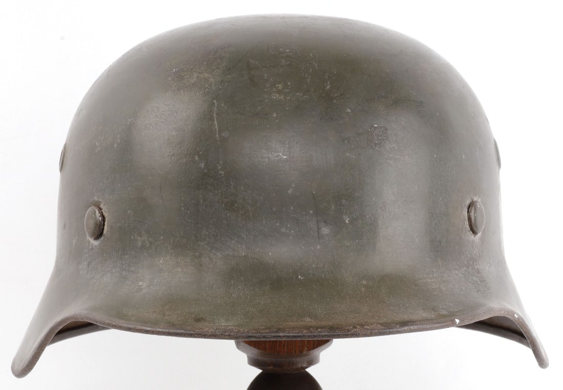 WWII GERMAN REICH M40 HELMET WITH WHITE WASH: Stahlhelm from the German Third Reich. Single Reichsadler decal helmet with most paint remaining. B & C 1943 metal liner. Size 61. EF68 marked on left interior. Reverse marked 21962. Leather likely re
