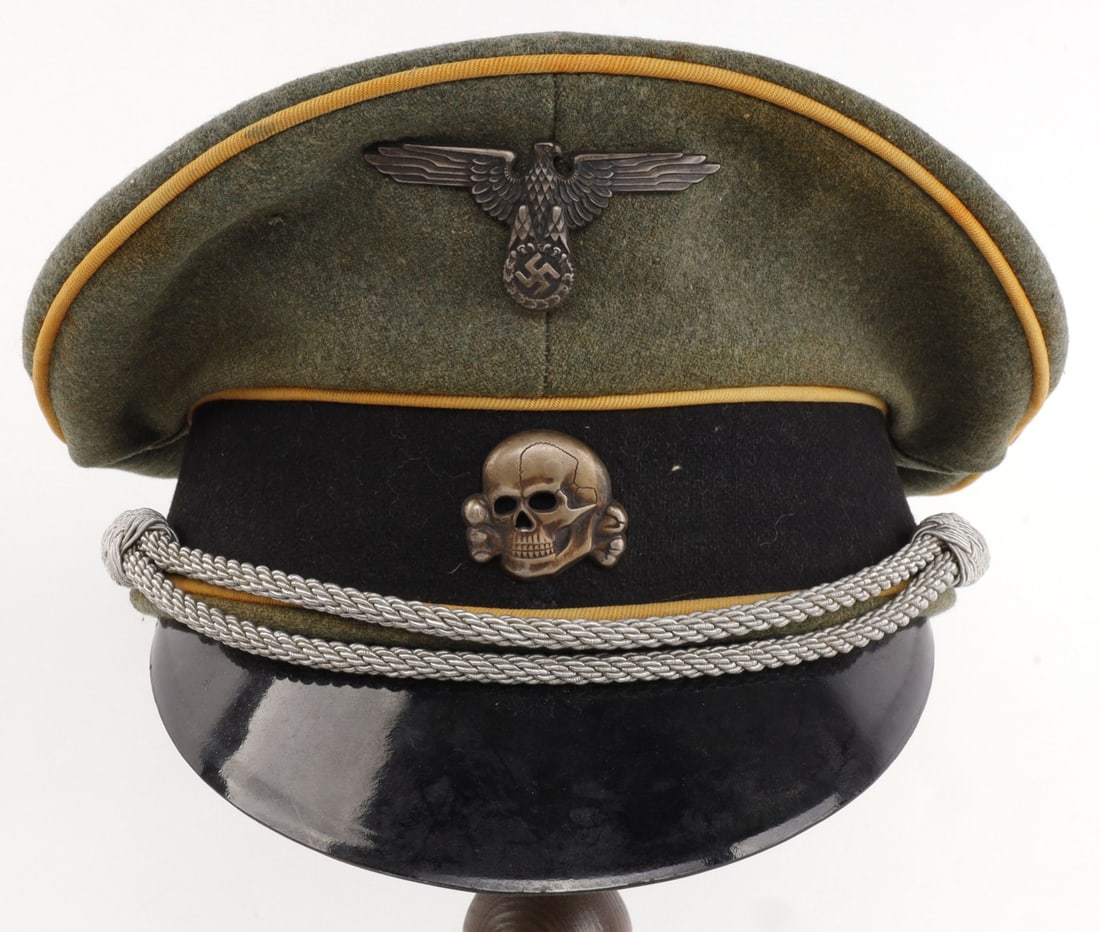 WWII GERMAN THIRD REICH WAFFEN SS CAVALRY VISOR: Field gray cloth with gold-yellow piping and black band. Silver bullion strap indicating an officer. Exterior is in very good condition with no holes and very light wear. Interior is also in very good