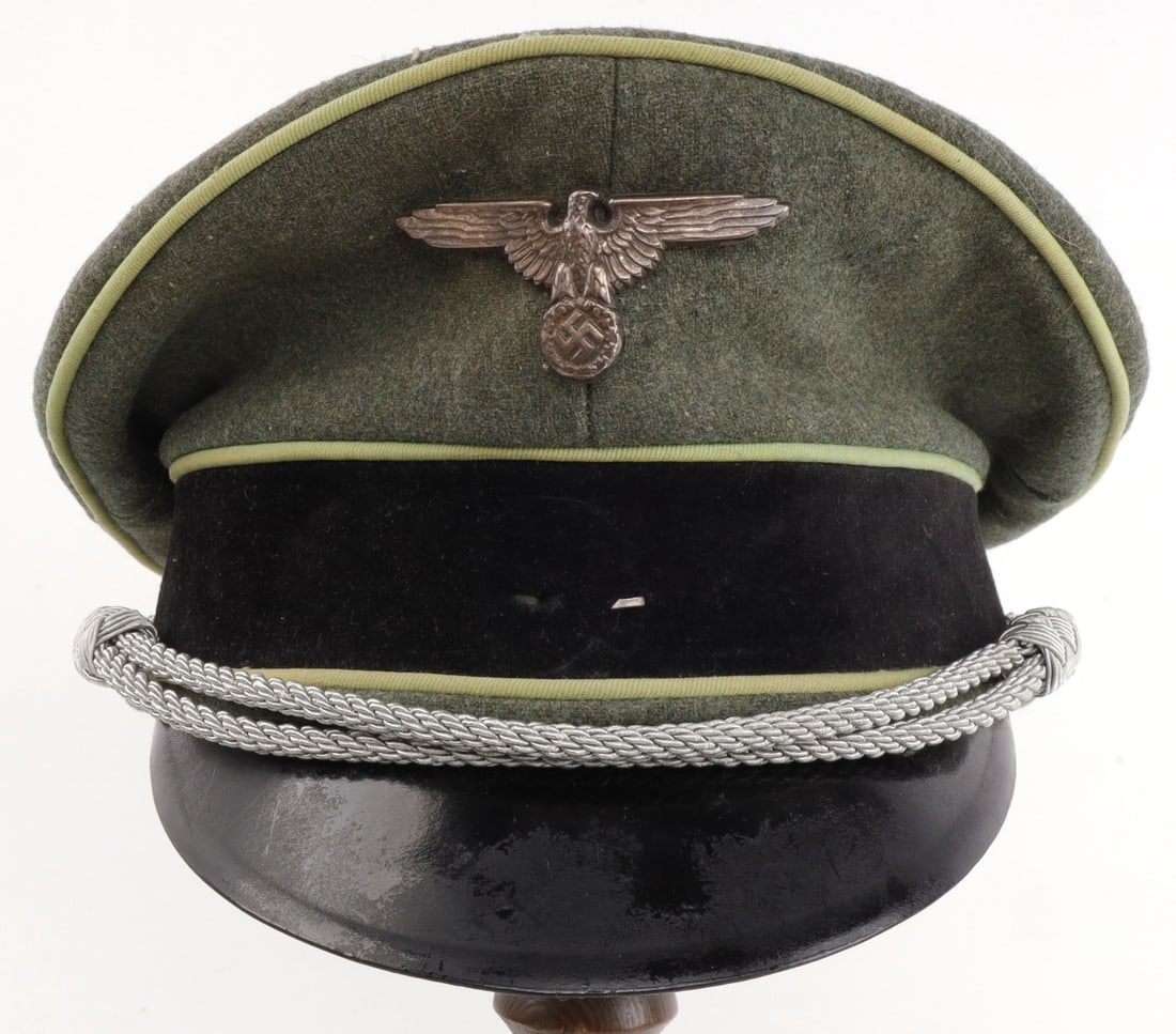 WWII GERMAN THIRD REICH KARL KUNZI SS VISOR: Green cloth with green piping. Silver bullion thread. Missing Totenkopf, but shadow is there. Piping overlaps and pig skin sweat band. Maker's mark indicates 'Karl Kunzi.' Likely a post-war re-enactor