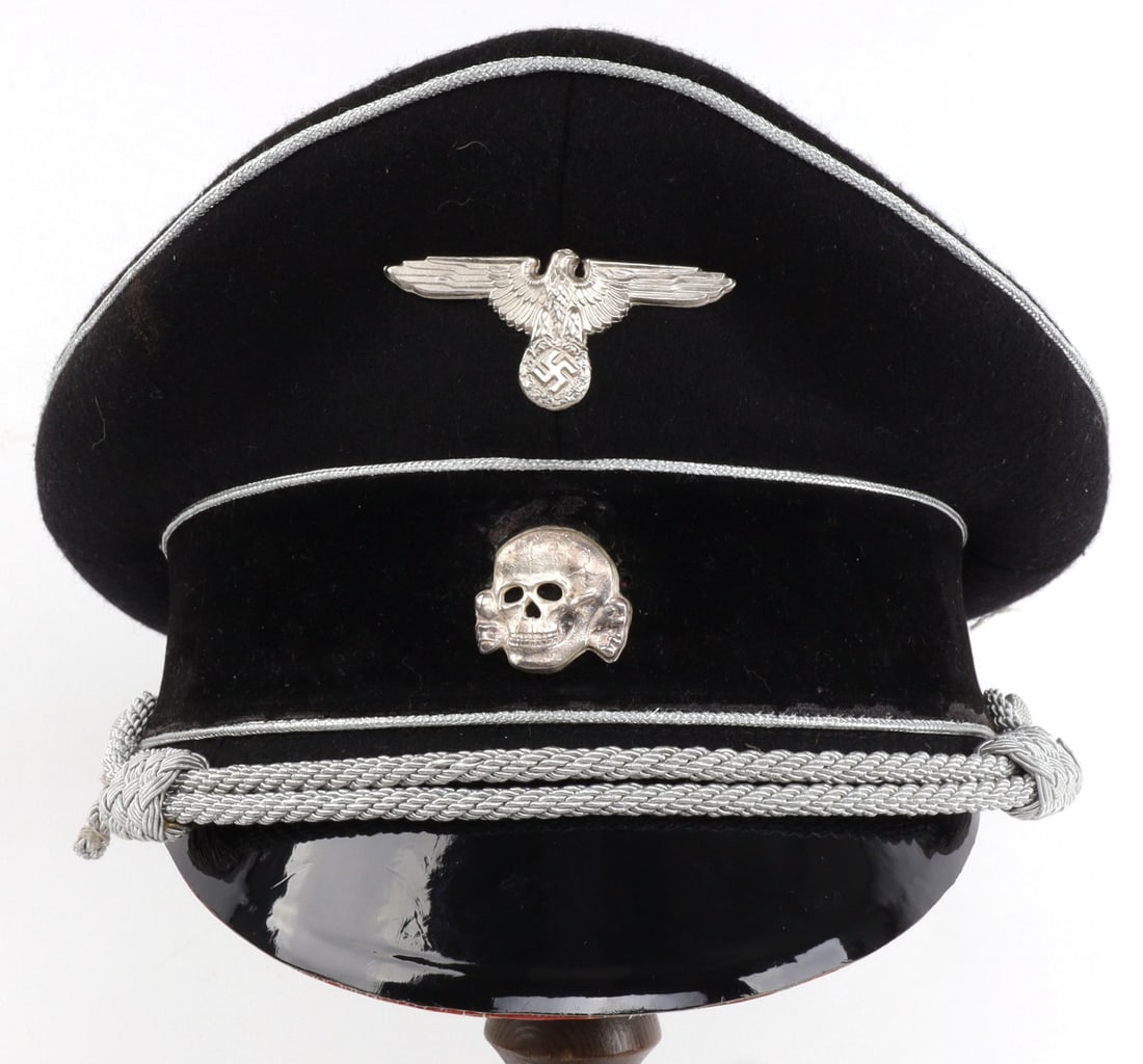 WWII GERMAN WAFFEN SS OFFICER VISOR EURO 57: Leather sweatband stamped D. Leder. Bullion strap has snapped. Leather sweatband stamped D. Leder. Bullion fluoresces. This is a high quality, post-war reenactment piece.
