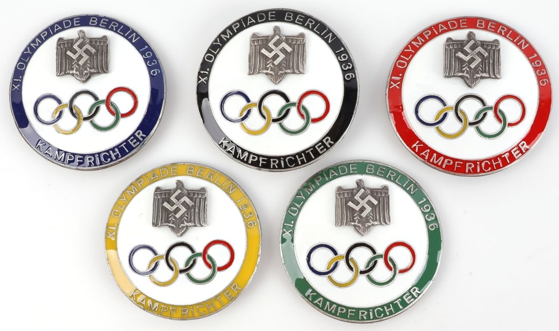 LOT OF 5 WWII GERMAN THIRD REICH OLYMPIC BADGES: Set of FIVE (5) 1936 Berlin Olympics judge badges, each color coded to correspond to the Olympic rings. 2 inch diameter. Unauthenticated, sold "as is."