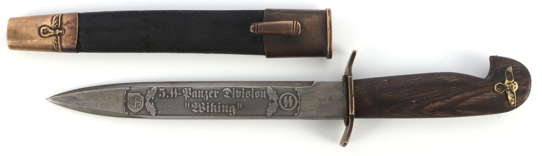 WWII GERMAN REICH WIKING PRESENTATION BAYONET: Presentation bayonet for the SS division "Wiking." Wood handle, leather and brass scabbard, and engraved blade. 12 inches. Unauthenticated, sold "as is."