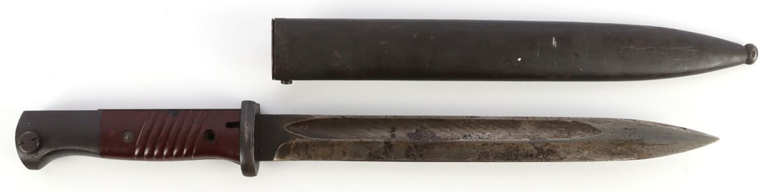 WWII GERMAN 43ASW K98 BAYONET W MATCHING SCABBARD: K98 Mauser bayonet with scabbard. Ricasso marked "43asw" and, on the reverse, "7448" over script "t." Scabbard has matching serial "7448" and "44asw." Blade 9-15/16 inches. 15 1/8 inches overall. Very