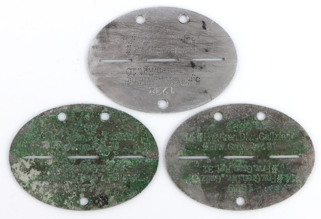 LOT 3 WWII GERMAN THIRD REICH FOREIGN SS DOG TAGS: Lot of THREE (3) Third Reich dog tags, all of them rare variants from foreign volunteers in the Waffen-SS. These include: 1) Walloon Legion (Belgium). 2) Ukrainian Waffen-SS Galizien (Ukraine). 3) Waf