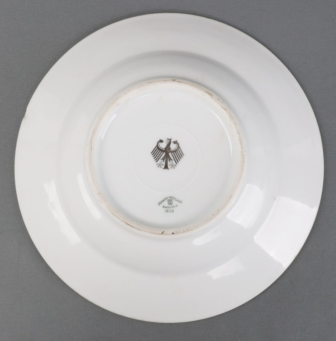 WWII GERMAN THIRD REICH PLATE WITH REICHSADLER: Third Reich-era plate from Germany. Reverse features a Reichsadler and the logo for Johann Haviland. Dated 1939. 9.25-inch diameter. Very good, original condition. This lot has a reserve.