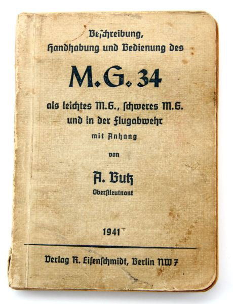 WWII GERMAN MG 34 MACHINE GUN FIELD MANUAL: WWII field manual for the German M. G. 34 machine gun. Printed in 1941. Some staining and pocket wear.