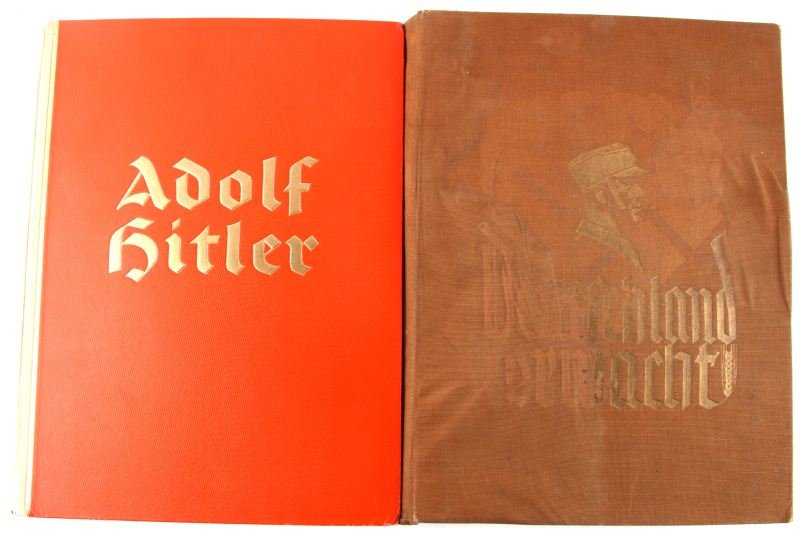2 WWII GERMAN CIGARETTE CARD BOOKS: Two German cigarette card books from WWII. One of Adolf Hitler, copyright 1936, and the other Deutschland Erwacht, copyright 1933. The first in very good condition, the second with water stain to cove