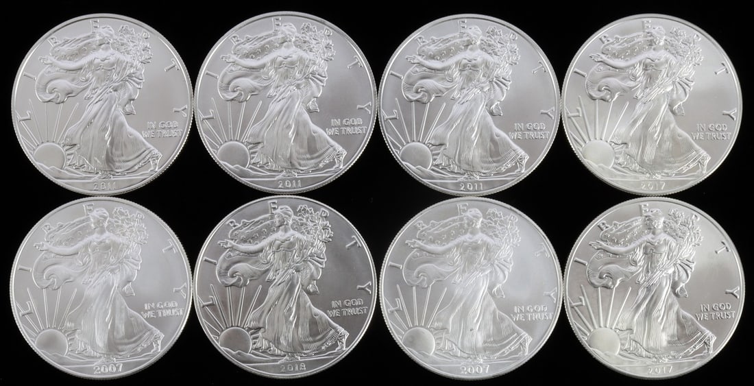 LOT 8 MIX DATE 1 OZT SILVER AMERICAN EAGLE COINS: Lot of EIGHT (8). All Brilliant Uncirculated. This lot reserved at melt.