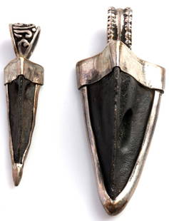 LOT OF 2 ARROWHEAD & SILVER MOUNT PENDANTS: Lot of TWO (2 broadhead arrowheads mounted in sterling silver. 2 inches and 1.75 inches. Each in very good, original condition. This lot has a reserve.