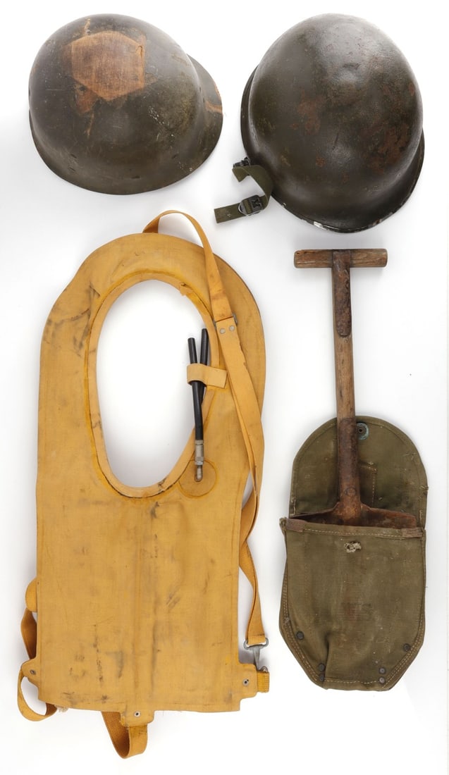 WWII MILITARIA LOT MAE WEST M1 HELMET ENTRENCHING: Front seam M1 helmet with Firestone liner, no visible heat stamp, 1944 dated Mae West Life vest, and heavy use Entrenching tool dated 1944, plus extra M1 liner paper.