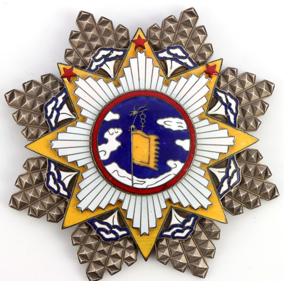 REPUBLIC OF CHINA ORDER OF CLOUD & BANNER: Military decoration of the Republic of China, this badge depicts clouds and a yellow banner against a blue sky. Multi-piece construction. With three red stars. 4-inch diameter. Very good, original con