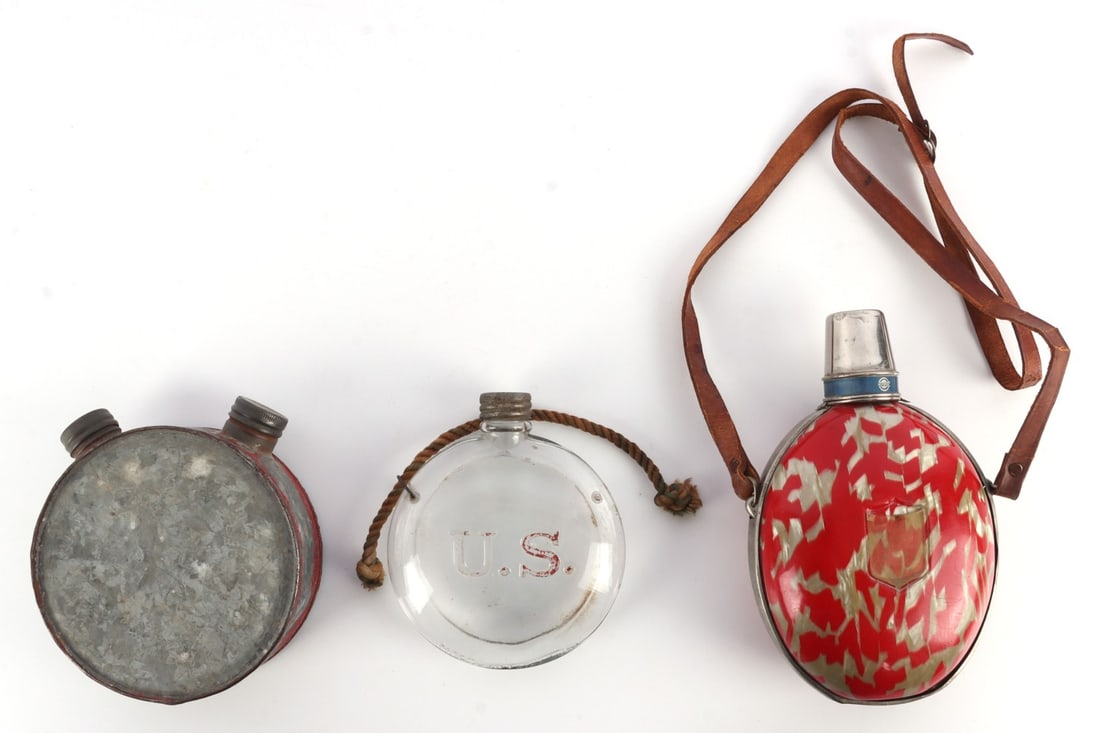 LOT OF 3 GLASS U.S. & JAPANESE WWII CANTEENS: Lot of THREE (3). Includes U.S. Embossed glass 5 X 4 inch canteen, ( can be used as size reference for others). 1930's Japanese Civilian Canteen, and two top metal canteen, this may be a powder cask,