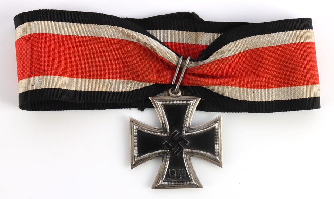 WWII GERMAN THIRD REICH IRON CROSS 1ST CLASS: WWII Iron Cross by Maybauer. The Iron Cross is magnetic, tests positive for a silver frame, shows seams to indicate that it was stamped metal, and there is an '800' silver mark. The Iron Cross weighs 