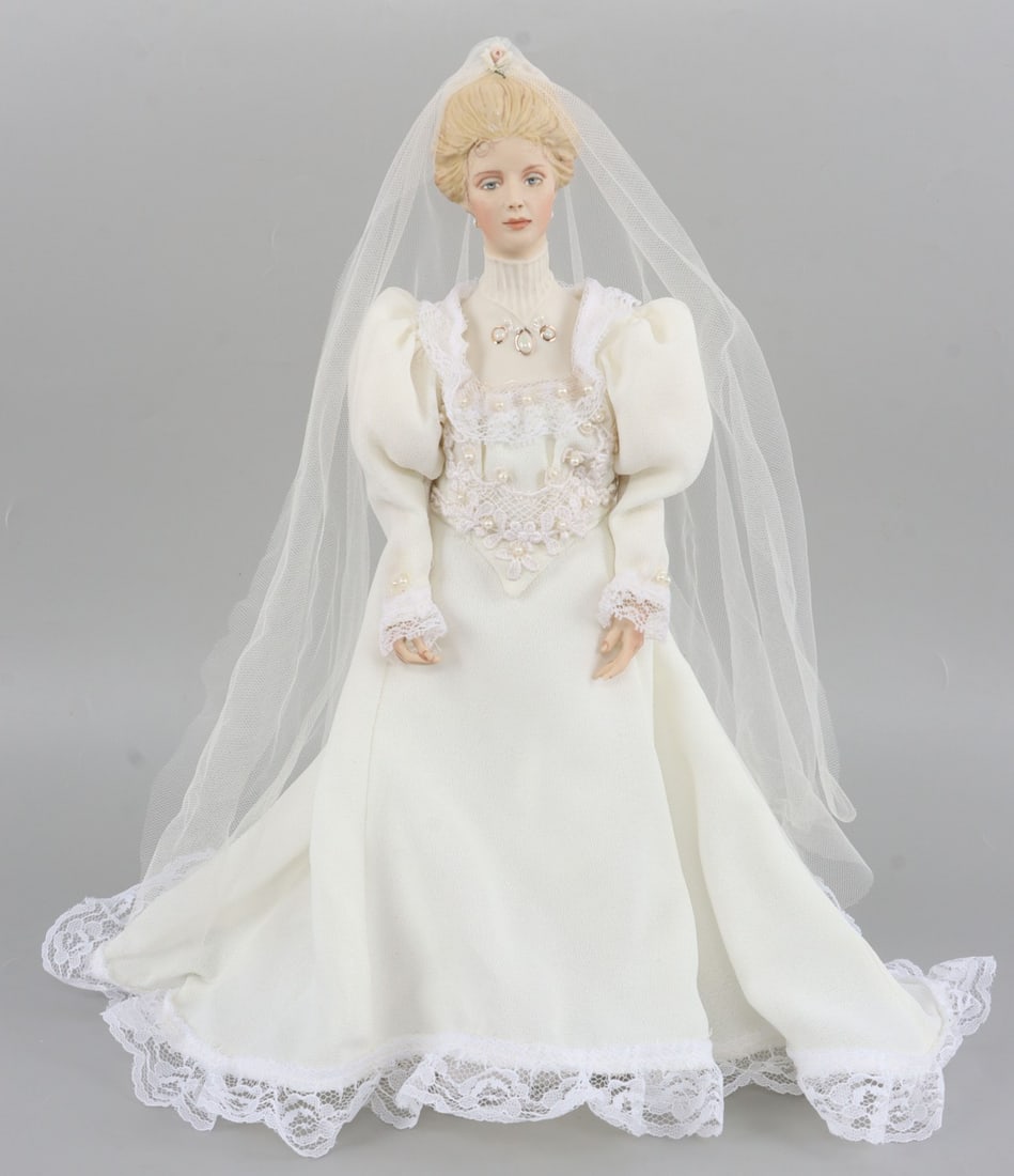 14 INCH ASHTON DRAKE PORCELAIN BRIDE DOLL: Ashton-Drake Porcelain Bride Doll. Marked on back, "1998, Region 9, Charlotte." 14 inches tall. Very good condition. This lot has a reserve.