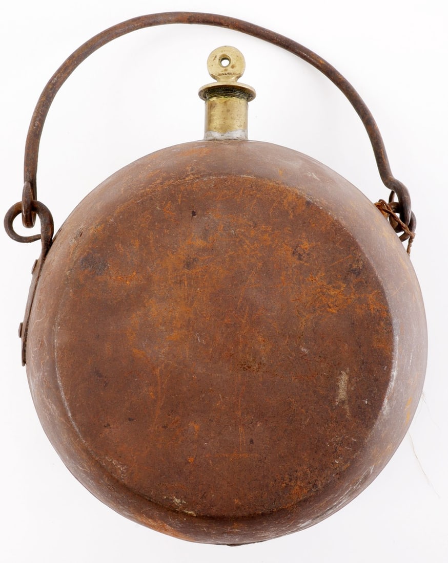 19TH CENTURY NORTH AMERICAN BEAR GREASE CANTEEN: Canteen for the carrying of bear grease, a popular hair growth tonic and trade item in 19th century North America, or other types of lard. Some oxidation. 7-inch diameter, 4.5 inches thick. Very good,