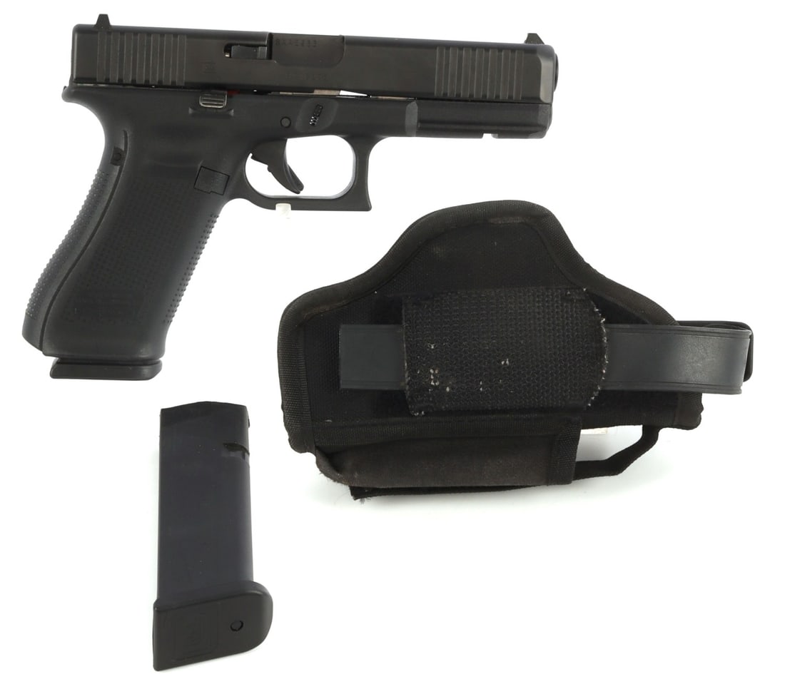 GLOCK 22 GEN 5 .40 S&W PISTOL + 2 MAGS & HOLSTER: Very good, used condition. 4.25-inch barrel. Clean, rifled bore. Front and rear sights. Textured grips. Polymer frame with matte black finish. Includes two (2) 15-round magazines and nylon Uncle Mike'