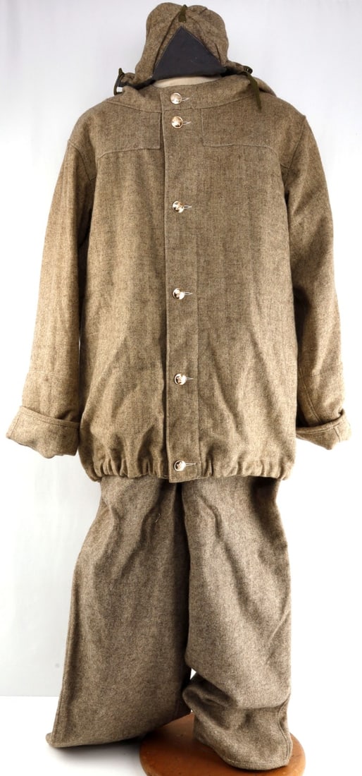 3 PC RUSSIAN WINTER UNIFORM WOOL SNOW SUIT SET: Soviet Russian 3-piece uniform snow suit of thick grey-brown wool. Includes hooded coat, pants and cap. Coat has six brass buttons with hammer & sickle inside star, marked on reverse "???????? 90." Pa