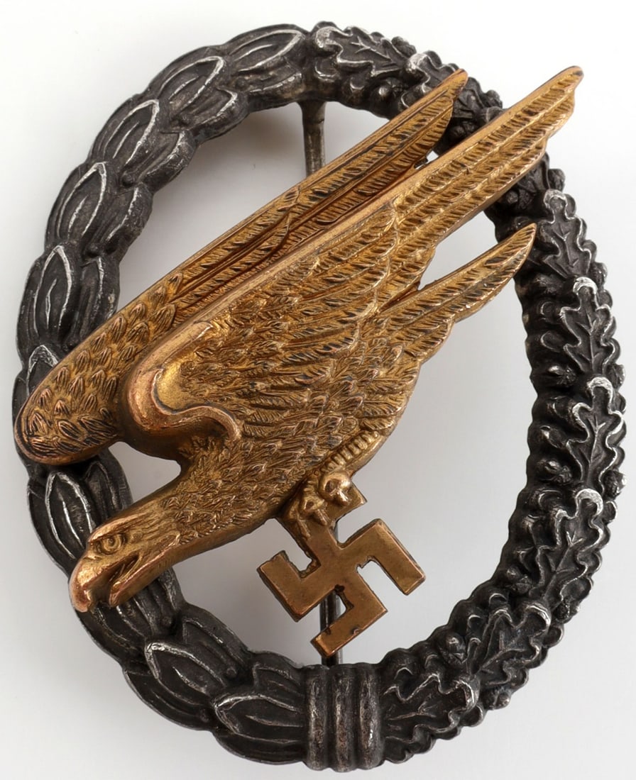 WWII GERMAN LUFTWAFFE PARATROOPER BADGE: Midwar zinc construction. C.E. Junker make. 2 inches. This lot has a reserve.