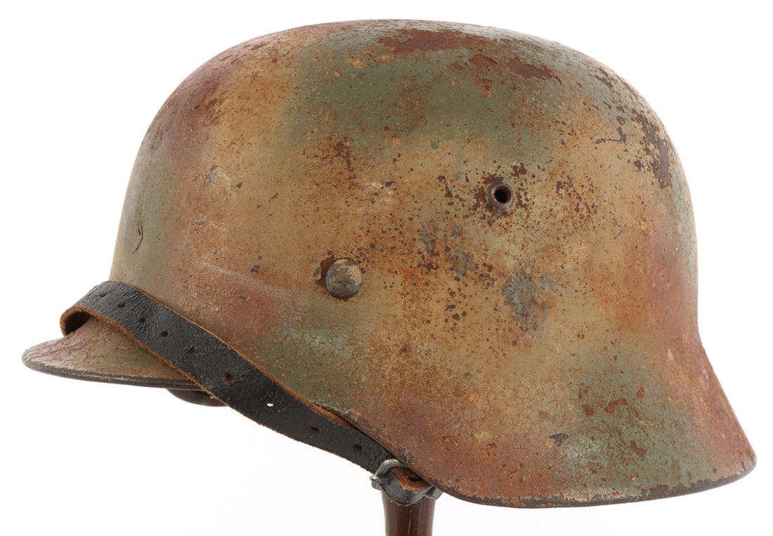 WWII GERMAN THIRD REICH M35 HELMET: Normandy camo. Interior rear marked 3101. No left side mark as expected. Leather fingers have been replaced. LITZMANNSTADT 1943 marked on steel liner. Unauthenticated, sold "as is."