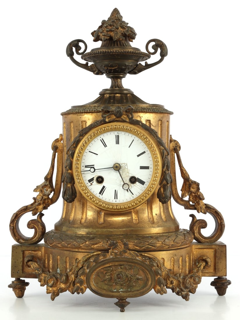 CLASSICAL GILDED BRONZE MANTLE CLOCK: Design is classical in nature, reminiscent of columns and Greco-Roman funeral decorations. 10 X 14 inches. Clock does not run and front crystal is missing.
