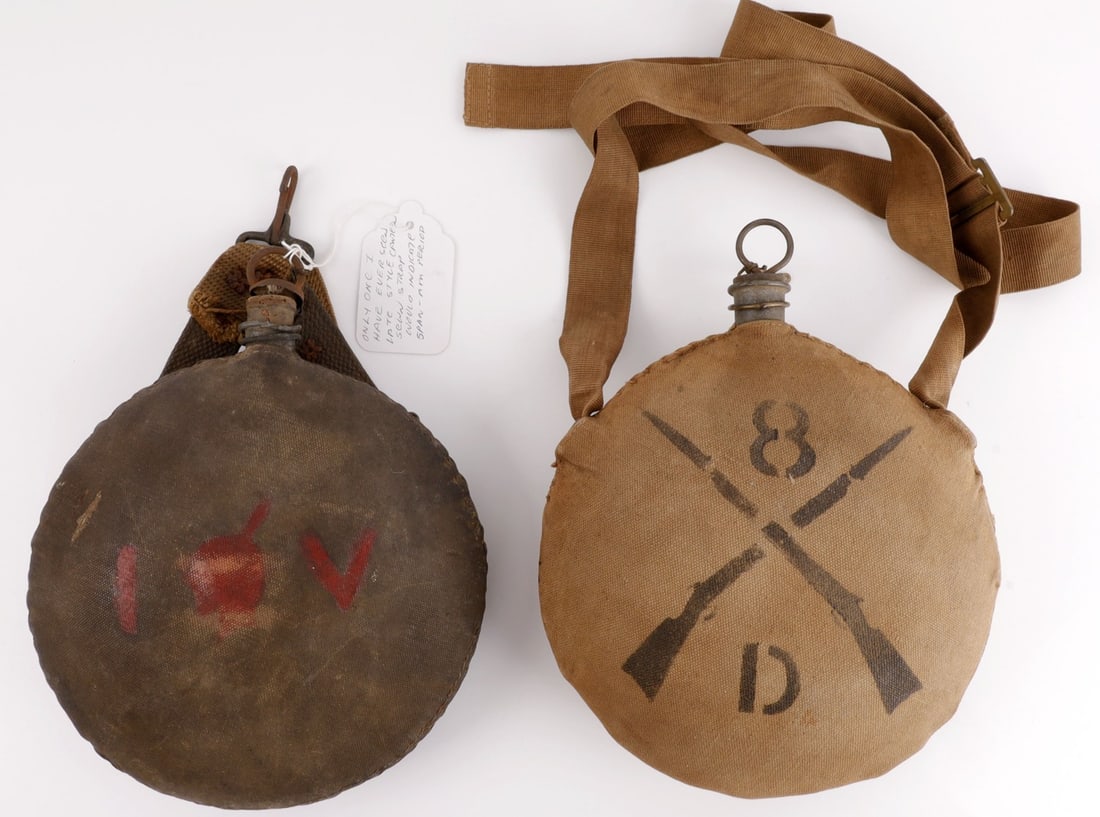 US 8TH INFANTRY CANTEEN & INDIAN VOLUNTEER CANTEEN: Lot of TWO (2) pieces. 1) US pattern 1874 canteen with Chambers strap, stopper and cotton duck cover with US 8th Infantry, Company D. 2) US canteen ca. 1878 with stopper, Y-strap with snap hook, and c