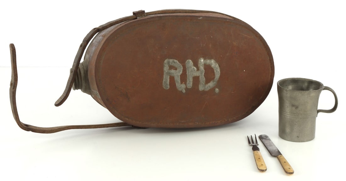RARE CIVIL WAR TIN CANTEEN FOOD MESS KIT COMBO: First one seen. Canteen mess kit combination. Leather strap keeps mess kit closed, has small pewter cup, with bone handled utensils. RHD initialed. 9 X 4 inches.