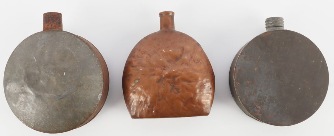 LOT 3 US CIVIL WAR CANTEENS CONFEDERATE ATTRIBUTED: Lot of THREE (3). Includes one (1) copper canteen and two (2) in the usual style of the Confederacy. Two have stops. Approx. 4 - 5 inches. Period: Civil War & Indian Wars