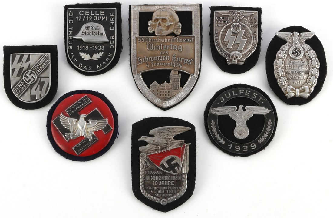 LOT 8 WWII GERMAN THIRD REICH ORGANIZATION SHIELDS: Lot of EIGHT (8) shields for Der Stahlhelm, Lubeck ten year, H. J. Bann march, SS Wintertag, Julfest 1939, SS Gruppwest march, Sturmabteilung, and Jena march. All unauthenticated and sold "as is."