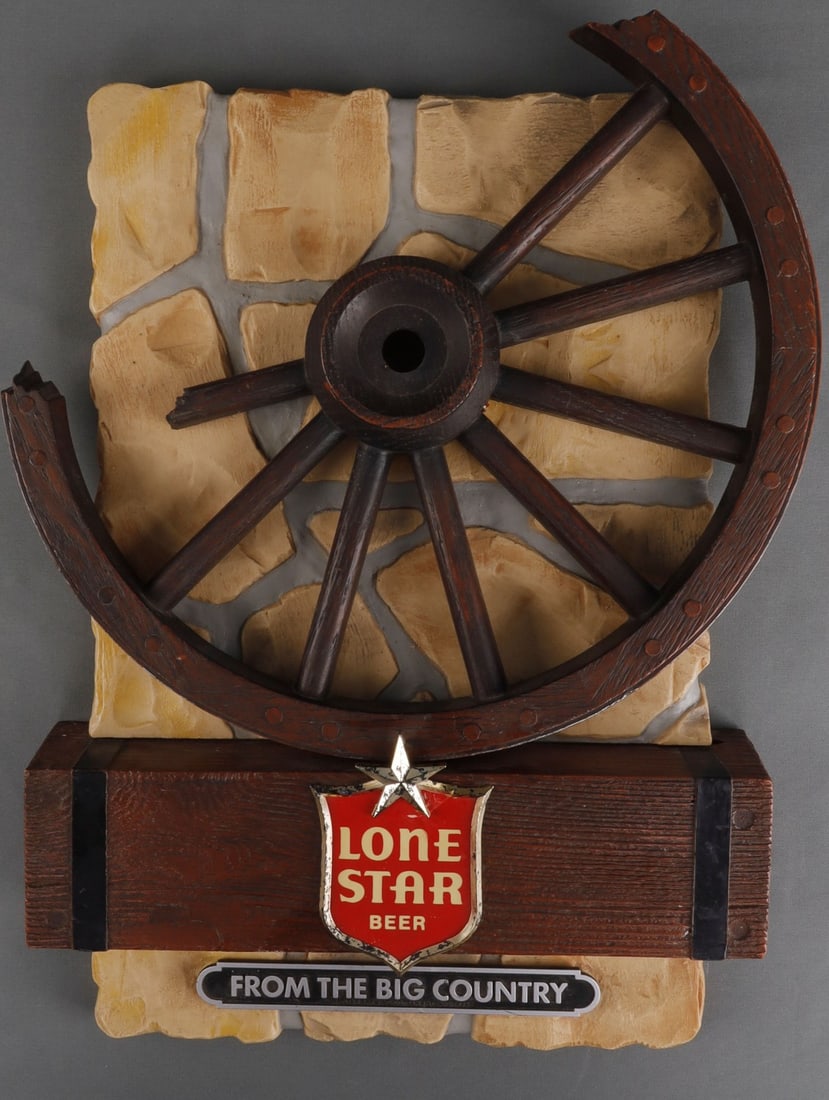 VINTAGE LONE STAR BEER WAGON WHEEL SIGN: Vintage broken wagon wheel plastic sign from Lone Star Beer company. The 'Lone Star Beer' shield has been broken and repaired, possibly twice. 13.5 X 19.5 inches. Good, original condition. This lot ha