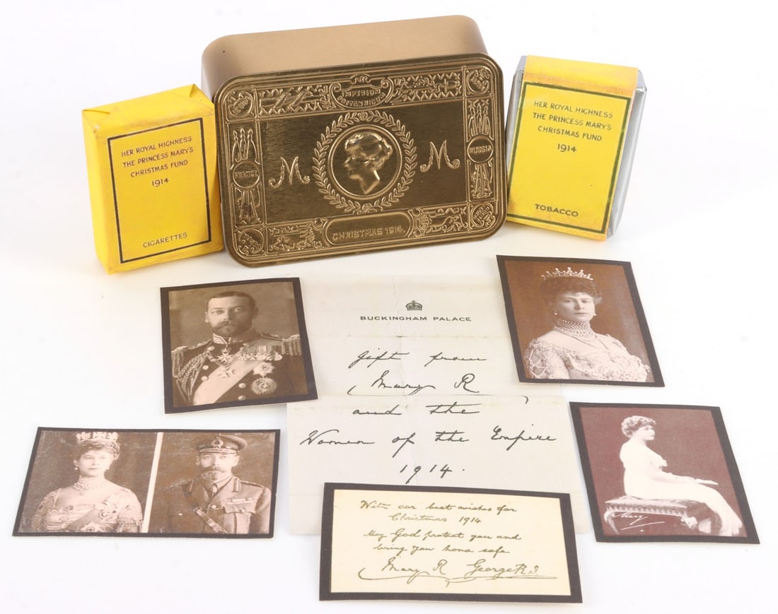 WWI PRINCESS MARY 1914 CHRISTMAS GIFT TIN REPLICA: Complete with all contents. Includes a wide array of items: small note on Buckingham Palace letterhead, Christmas card with envelope, four small photographs, a small note card, two small packs of "cig