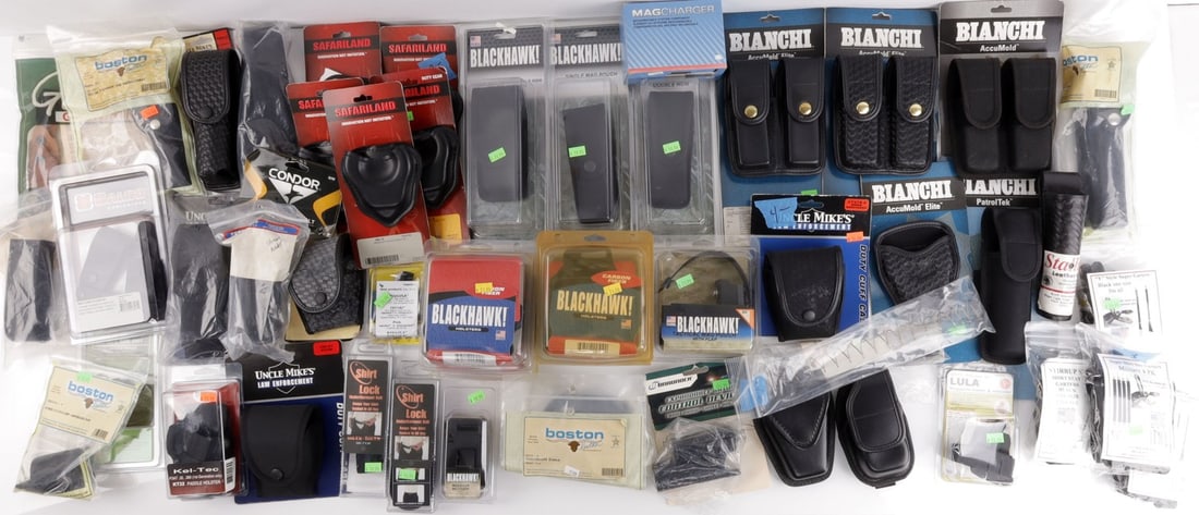 DEALERS LOT OF 45 DUTY GEAR SAFARILAND BLACKHAWK: Dealer's lot of approx. FORTY-FIVE (45+/-) pieces new in box law enforcement duty gear including mag pouches, cuff pouches, holster & equipment belt mounts, firearm parts and accessories.