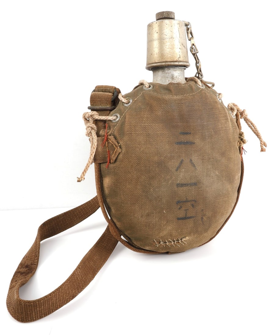 WWII JAPANESE AIR CREW CANTEEN 281ST FLIGHT: WWI air crew canteen with screw on top and intact cover/sling. Cover has ink stamp reading, '281st Sky,' referencing a military unit. Very good, original condition. 7 X 10 inches. Origin: Japan