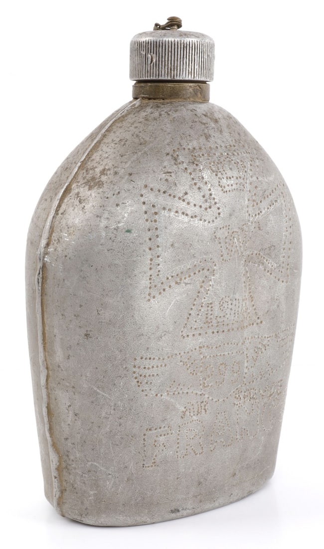 WWI US ARMY AIR SERVICE ETCHED CANTEEN FLASK: US Army canteen that has been etched with both Air Services and German symbols. On one side there is a 1914 Iron Cross, Air Service symbol with '299,' and the word 'France.' On the other side, there i
