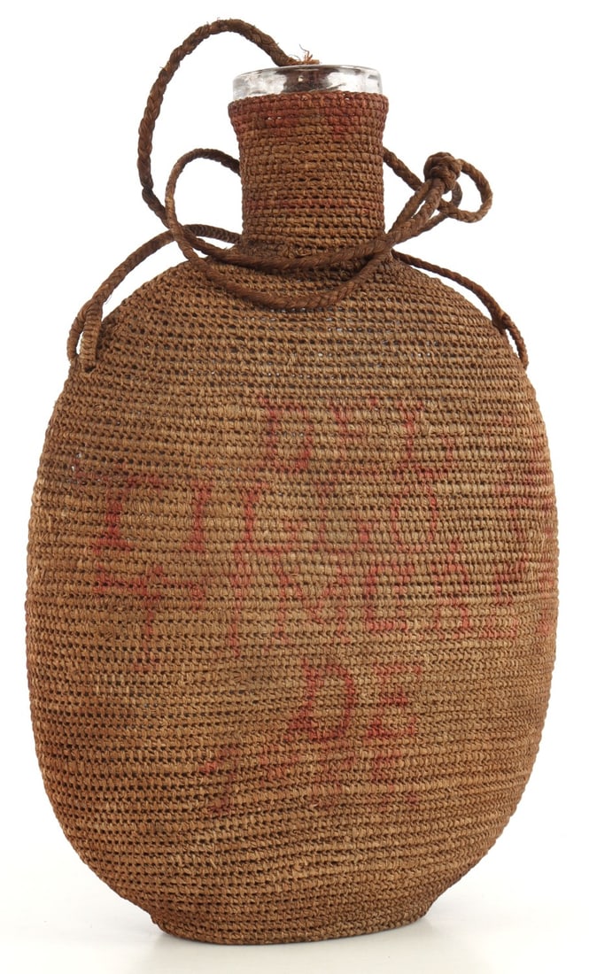 MEXICAN GLASS CANTEEN WITH WICKER CASE: Dated 1885. Handwritten "Del Saltillo Se Timare 28 De 1885". 6.75 inches. Includes stop.