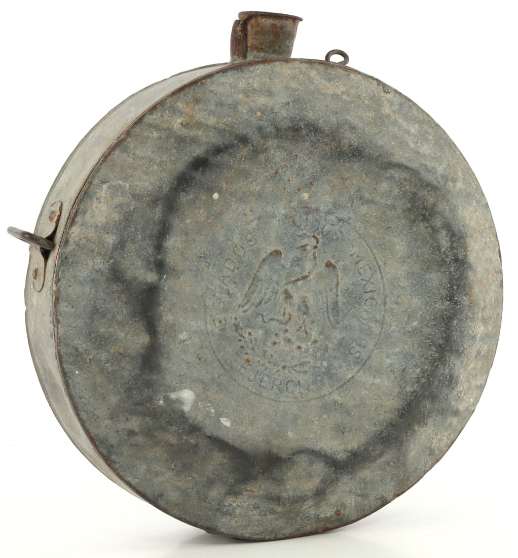 1900'S MEXICAN REVOLUTION ARMY CANTEEN: Circa 1910 Mexican Army canteen. Mexican eagle/snake in center with the words "Estados Unidos Mexicanos Ejercito" (United Mexican States Army.) Some detail loss and signs of wear present. Complete wit