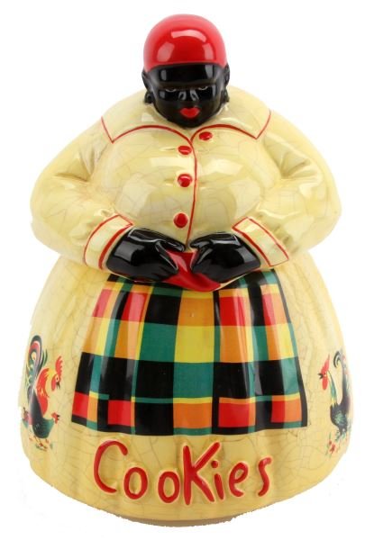 MCCOY BLACK MAMMY COOKIE JAR: Black Mammy archetype cookie jar by McCoy. Measures approximately 11 inches in height. No chips or breaks, but with a consistent craquelure. Overall in very good condition.