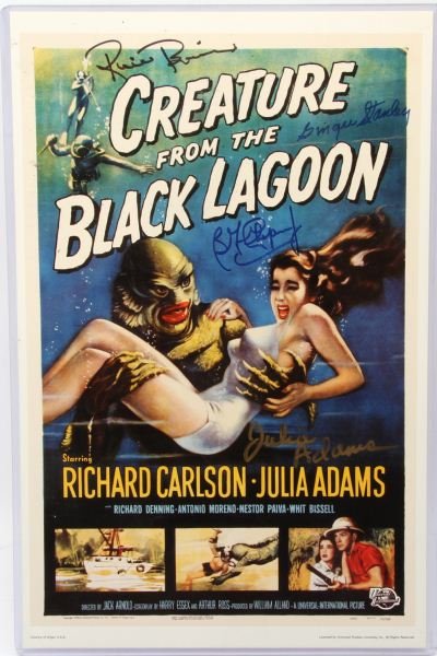 SINGED CREATURE FROM THE BLACK LAGOON MOVIE POSTER: Original signatures on a reproduction Universal Studios movie card measuring 11 by 17 inches. Signed by Julie Adams, Ricou Browning, Ben Chapman, and Ginger Stanley. Print and unauthenticated signatur
