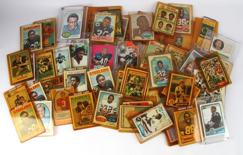 EX DEALER STOCK FOOTBALL CARDS LOTS OF ROOKIE: Useful collection of cards , O.J. Simpson rookie and several more, Roger Staubach rookie, signed Earl Campbell, Archie Manning rookie, Tony Dorsett, , John Brodie, Walter Payton, and more rookie cards