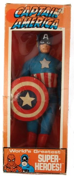 1972 MEGO CAPTAIN AMERICA IN ORIGINAL BOX: Mego Captain America Action Figure with Original Box 1972. Box has overall wear and a piece cut out, ad sticker on shield is dried out but still attached. Overall it is in good to very good condition.