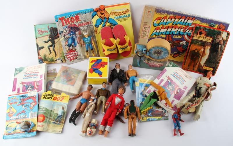 VINTAGE SUPERHERO & ACTION TOY FIGURES: 1979 Amazing Spiderman Sandals with package, Disney’s Zorro Authorized TV Edition book, 1976 Batman Janex clock(not tested), Indian action figures from Johnny West (Marx), Tonka Super Naturals Eagle