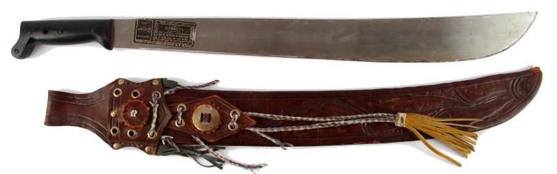 MACHETE W/ HAND-MADE LEATHER SCABBARD EL SALVADOR: Corneta brand machete with hand-made decorative leather scabbard, both made in El Salvador. Very good condition.